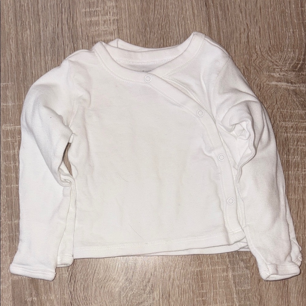 2 white long sleeve baby shirt